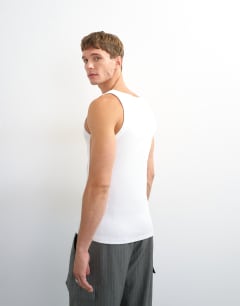 Model wearing Premium square neck ribbed vest in white