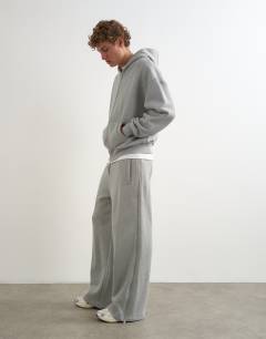 Model wearing Premium wide leg heavyweight full side zip jogger in grey marl