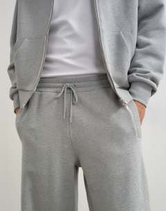 Model wearing Premium wide leg heavyweight full side zip jogger in grey marl