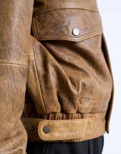 Model wearing Real leather double pocket coat in tan