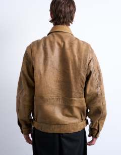Model wearing Real leather double pocket coat in tan