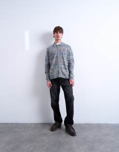 Model wearing Regular fit button polo with space-dye knit in multi