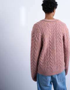 Model wearing Regular fit cable knitted cardigan in pink