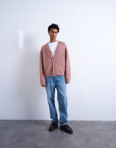 Model wearing Regular fit cable knitted cardigan in pink