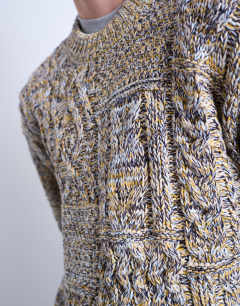 Model wearing Regular fit cable knitted jumper in yellow twist