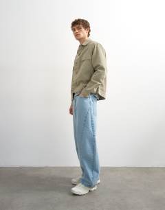 Model wearing Regular fit canvas overshirt in putty