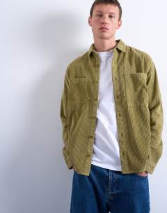 Model wearing Regular fit cord shirt in washed green