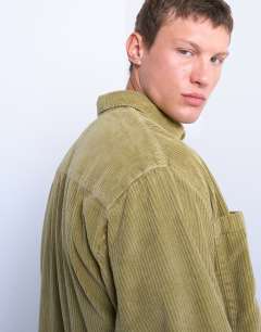 Model wearing Regular fit cord shirt in washed green