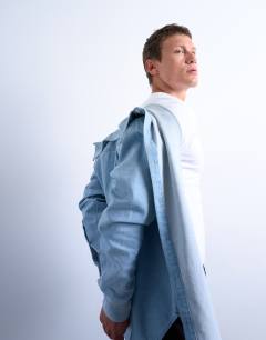 Model wearing Regular fit denim long sleeve shirt in  light wash