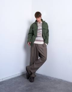 Model wearing Regular fit fairisle stripe knitted polo in ecru