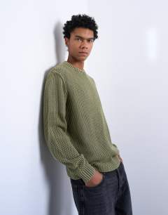 Model wearing Regular fit knitted jumper in washed green