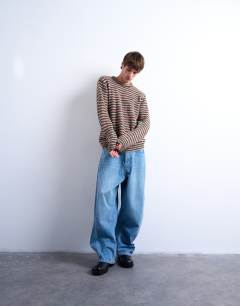 Model wearing Regular fit knitted twist stripe jumper in khaki