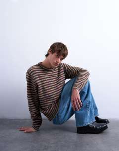 Model wearing Regular fit knitted twist stripe jumper in khaki