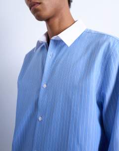 Model wearing Regular fit long sleeve formal stripe shirt with contrast collar in blue