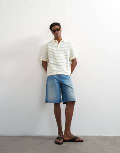 Model wearing Regular fit machine crochet polo in blue