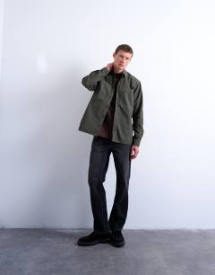 Model wearing Regular fit ripstop overshirt in washed khaki