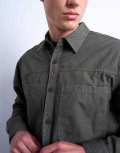 Model wearing Regular fit ripstop overshirt in washed khaki