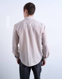 Model wearing Regular fit sheer stripe shirt in stone