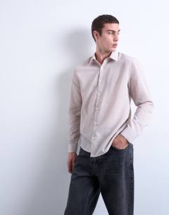 Model wearing Regular fit sheer stripe shirt in stone