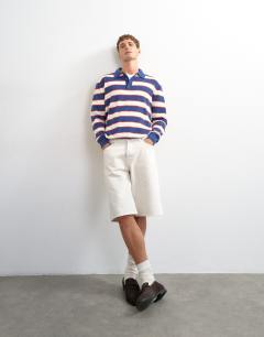 Model wearing Regular fit striped knitted polo in navy