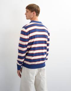 Model wearing Regular fit striped knitted polo in navy