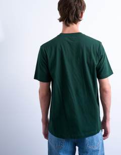 Model wearing Regular fit t-shirt in pine green
