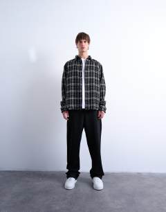 Model wearing Regular fit textured check overshirt in black