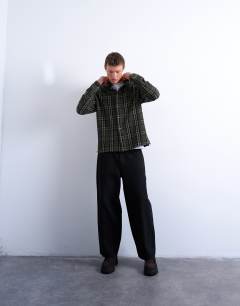 Model wearing Regular fit textured check overshirt in green