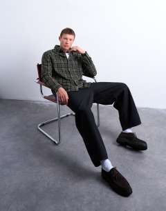 Model wearing Regular fit textured check overshirt in green