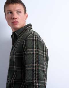 Model wearing Regular fit textured check overshirt in green