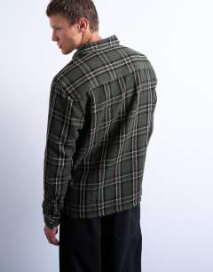 Model wearing Regular fit textured check overshirt in green