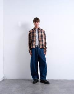 Model wearing Regular fit textured check overshirt with zip in navy