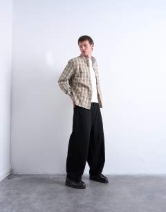 Model wearing Regular fit textured check shirt in stone