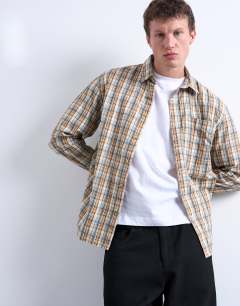 Model wearing Regular fit textured check shirt in stone