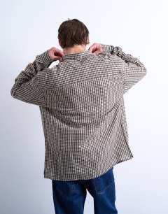 Model wearing Regular fit textured gingham check shirt in brown