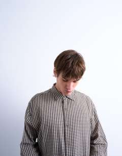 Model wearing Regular fit textured gingham check shirt in brown