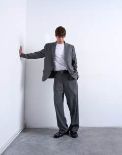 Model wearing Relaxed boxy blazer in charcoal pinstripe