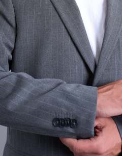 Model wearing Relaxed boxy blazer in charcoal pinstripe