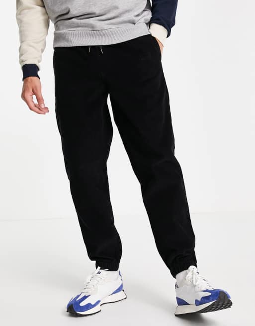 Topman relaxed cord jogger trousers in washed black ASOS