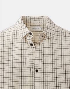 Model wearing Relaxed crop fit check shirt in ecru