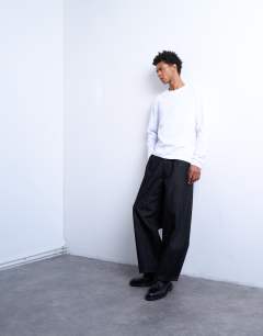 Model wearing Relaxed cropped fit long sleeve t-shirt in white