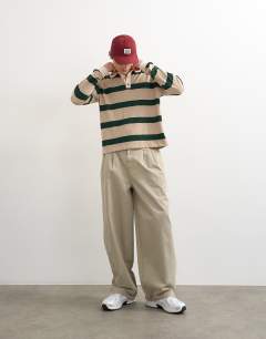 Model wearing Relaxed cropped wool mix long sleeve rugby polo in stone and green