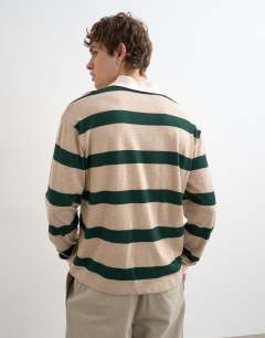 Model wearing Relaxed cropped wool mix long sleeve rugby polo in stone and green