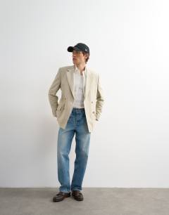 Model wearing Relaxed double breasted stripe blazer in stone