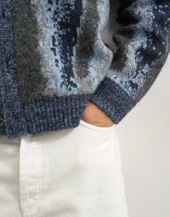 Model wearing Relaxed fit abstract stripe knitted cardigan in dark grey