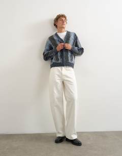 Model wearing Relaxed fit abstract stripe knitted cardigan in dark grey