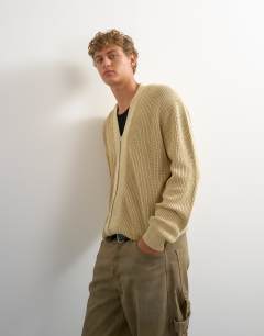 Model wearing Relaxed fit acid wash knitted zip through cardigan in beige