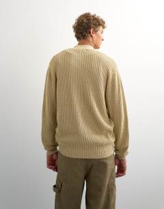 Model wearing Relaxed fit acid wash knitted zip through cardigan in beige