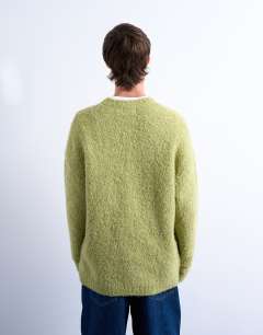 Model wearing Relaxed fit boucle jumper in green