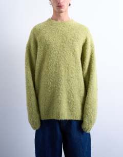 Model wearing Relaxed fit boucle jumper in green